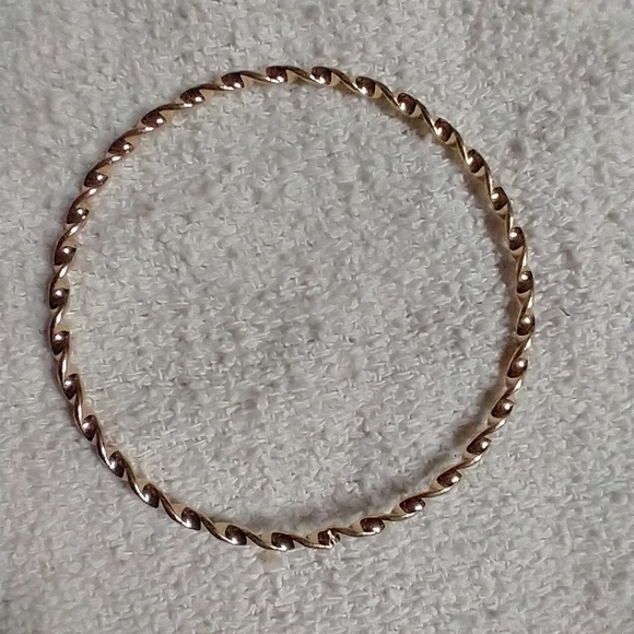 Goldtone twisted Bangle bracelet 2.75 i.d. - Picture 2 of 2